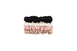A set of soft silk scrunchies arranged neatly, showcasing their smooth texture and elegant look, ideal for everyday hair styling in warm weather. 
